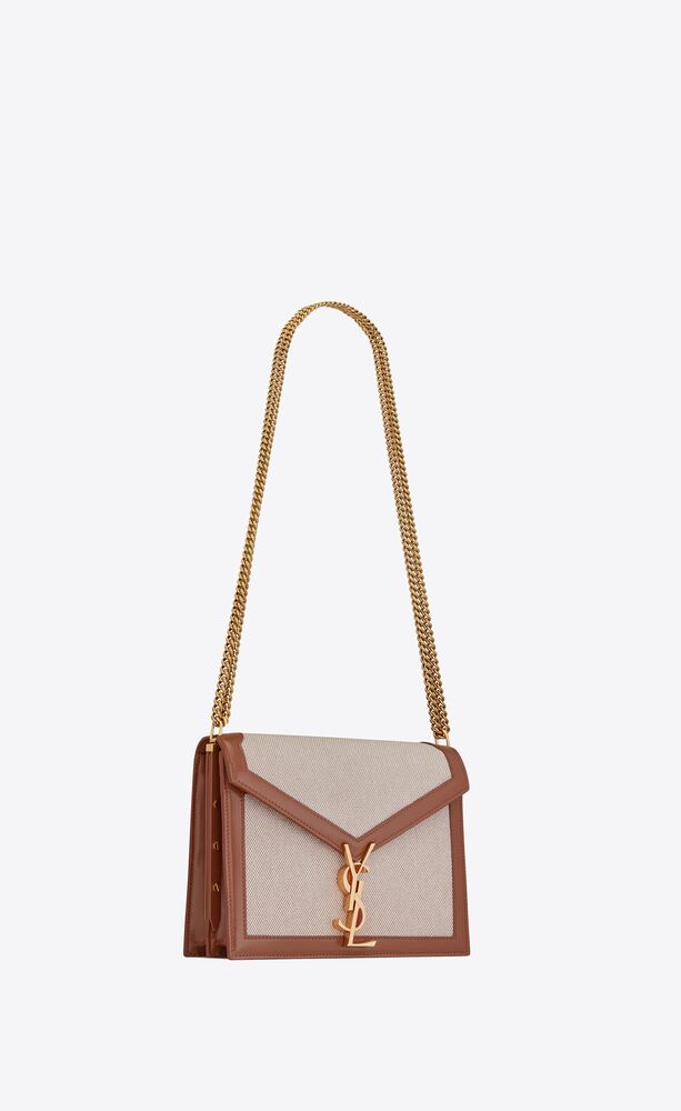 SaintLaurent_cassandra monogram clasp bag in canvas and smooth leather