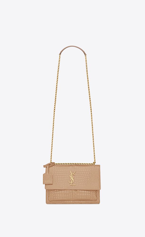 SaintLaurent_sunset medium in shiny crocodile-embossed leather