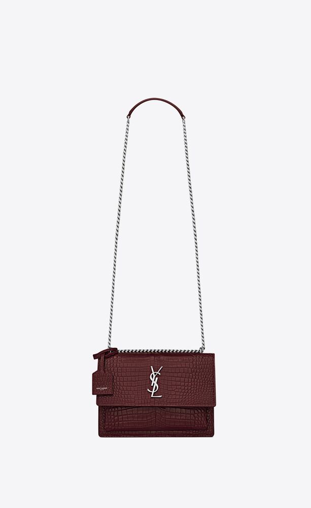 SaintLaurent_sunset medium in shiny crocodile-embossed leather