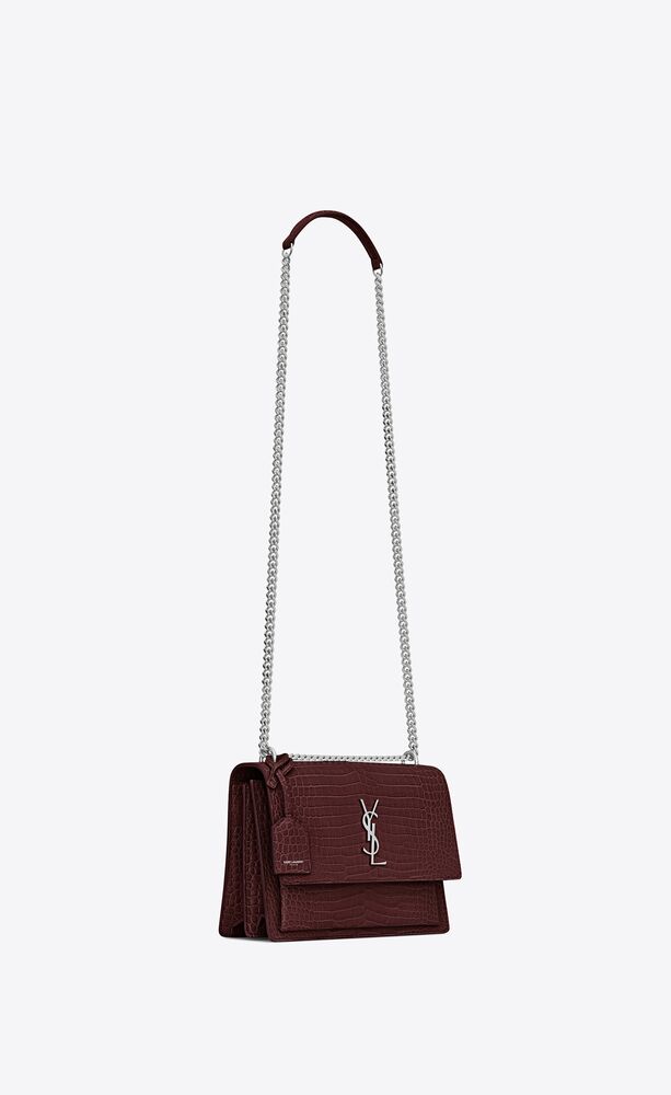 SaintLaurent_sunset medium in shiny crocodile-embossed leather