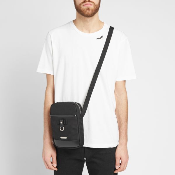 SaintLaurent_블랙 나일론 캔버스 및 블랙 가죽 소재의 리빙턴 파우치